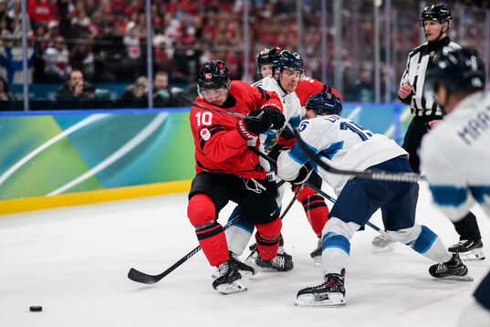 Nick Suzuki of Canada and Anton Lundell of Finland in the