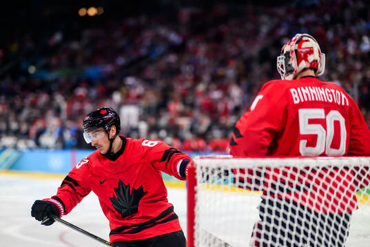 Brad Marchand and goaltender Jordan Binnington of Canada in
