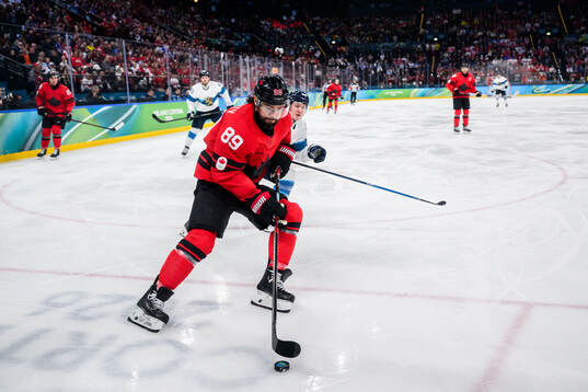 Drew Doughty of Canada and Joel Kiviranta of Finland in the