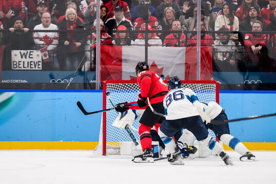 Nathan MacKinnon of Canada against goaltender Juuse Saros