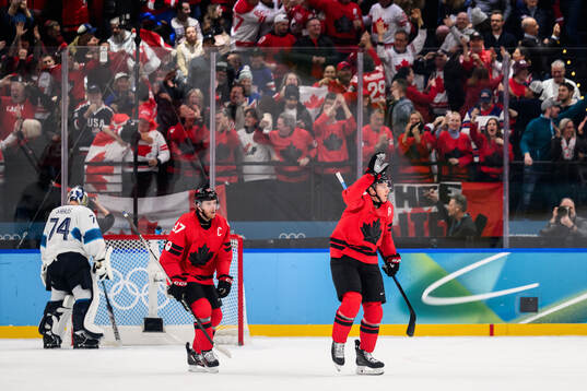 Connor McDavid and Nathan MacKinnon of Canada celebrate the