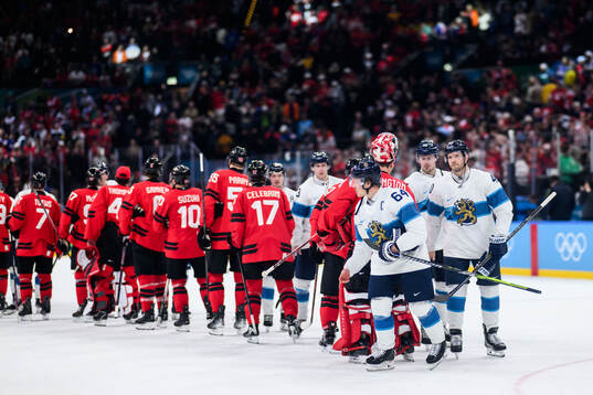 Mikael Granlund and Joel Armia of Finland looks dejected