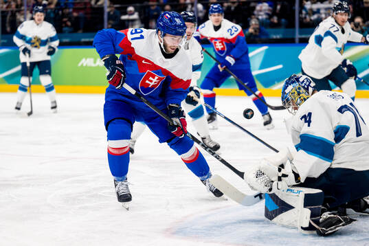 Matus Sukel of Slovakia and goaltender Juuse Saros of