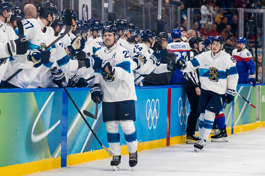 Sebastian Aho of Finland celebrates scoring 0-1  in the