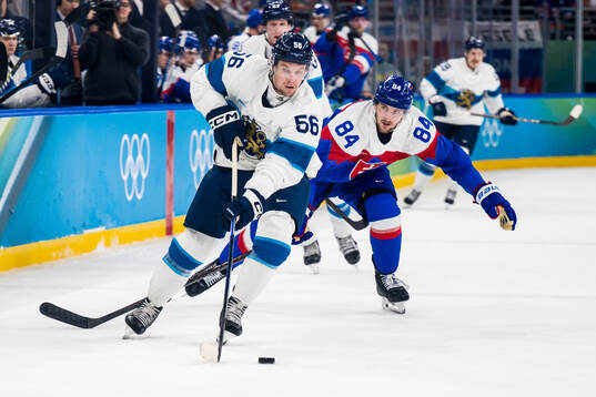 Erik Haula of Finland and Pavol Regenda of Slovakia in the