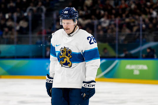 Eeli Tolvanen of Finland looks dejected in the men's ice