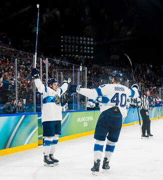 Erik Haula and Joel Armia of Finland celebrate scoring 0-2
