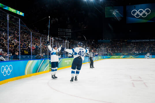 Erik Haula and Joel Armia of Finland celebrate scoring 0-2
