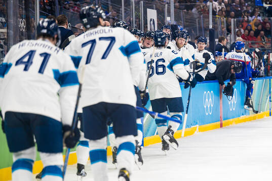 Erik Haula of Finland celebrates 0-2 in the men's ice