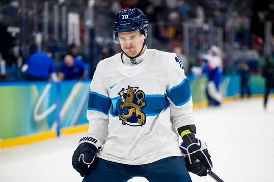 Henri Jokiharju of Finland looks dejected