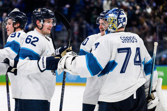 Artturi Lehkonen and goaltender Juuse Saros celebrate