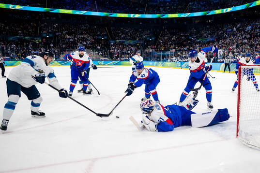 Kaapo Kakko of Finland and goaltender Samuel Hlavaj of