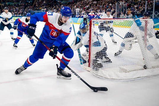 Adam Ruzicka of Slovakia and goaltender Juuse Saros of