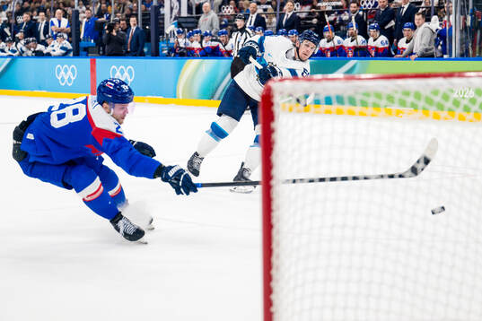 Erik Haula of Finland scoring 1-6 behind Martin Gernat of