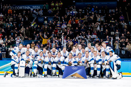 Players of Finland celebrate with their bronze medals at
