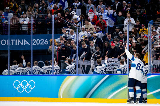 Players of Finland celebrate with their bronze medals