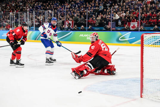 Brock Nelson of USA against Cale Makar and goaltender