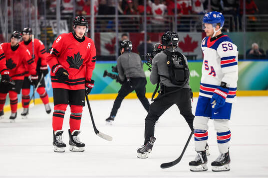 Cale Makar of Canada celebrate and Jake Guentzel of USA