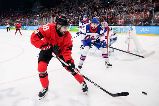 Brandon Hagel of Canada and Quinn Hughes of USA in the