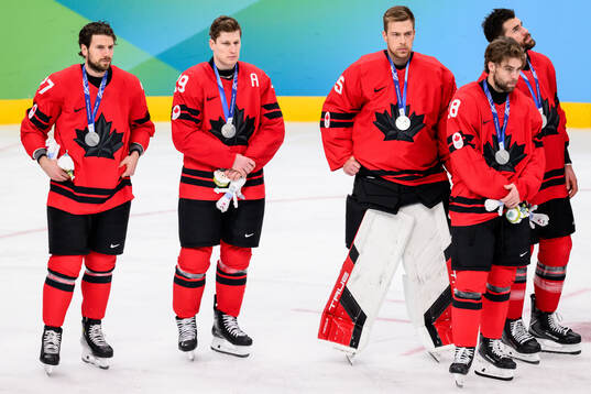 Nathan MacKinnon of Canada looks dejected