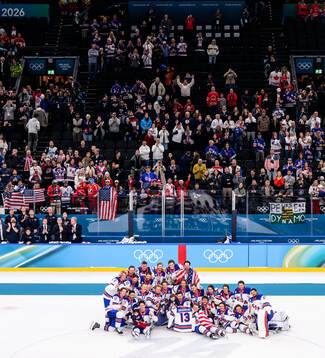 Players of USA celebrate with the shirt of Johnny Gaudreau