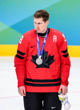 Nathan MacKinnon of Canada looks dejected