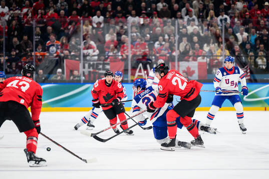 Dylan Larkin of USA and Thomas Harley of Canada in the