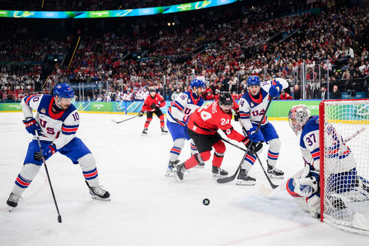 Seth Jarvis of Canada against JT Miller, Vincent Trocheck,