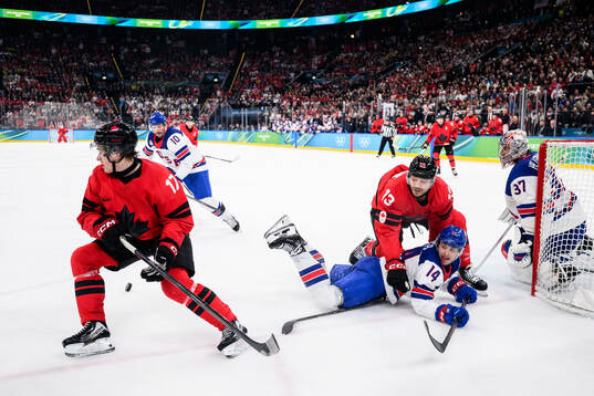 Macklin Celebrini and Sam Reinhart of Canada against Brock