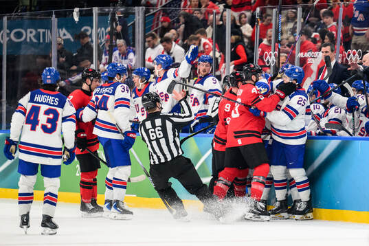 Tom Wilson of Canada and Charlie McAvoy of USA in the men's