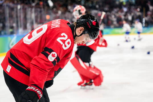 Nathan MacKinnon of Canada looks dejected