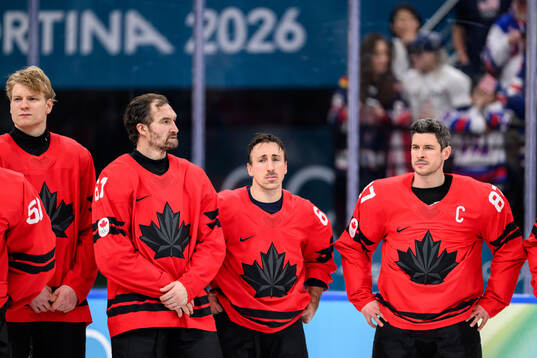 Mark Stone, Brad Marchand and Sidney Crosby of Canada looks