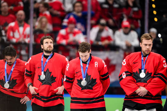 Nathan MacKinnon of Canada looks dejected
