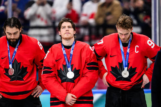Sam Bennett and Connor McDavid of Canada looks dejected