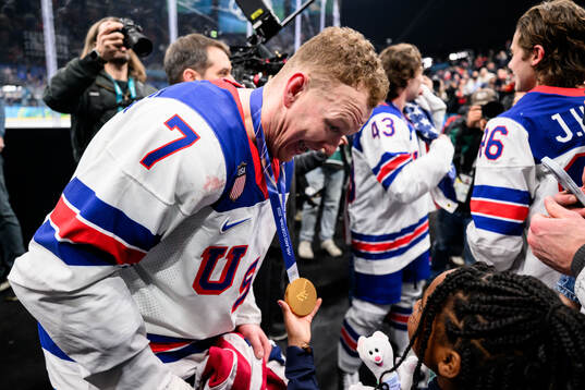Brady Tkachuk of USA celebrate