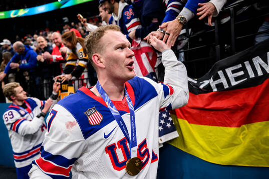 Brady Tkachuk of USA celebrate