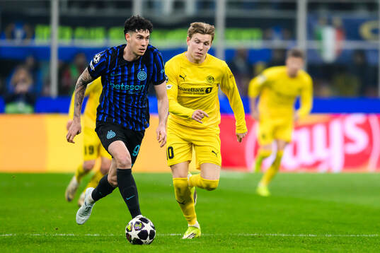 Alessandro Bastoni of Inter and Jens Petter Hauge of