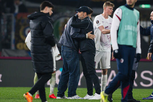 Eivind Helland of Bologna and head coach Freyr