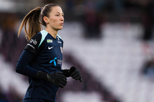 Goalkeeper Cecilie Hauståker Fiskerstrand of Norway warms
