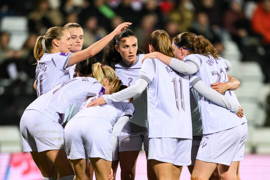 Lisa Naalsund of Norway celebrates with teammates