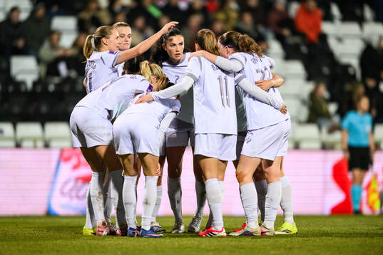 Lisa Naalsund of Norway celebrates with teammates