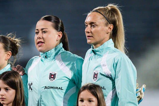 Goalkeeper Mariella El Sherif and Sarah Puntigam of Austria