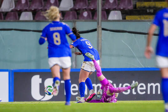 Martina Piemonte of Italy and goalkeeper Jennifer Falk of