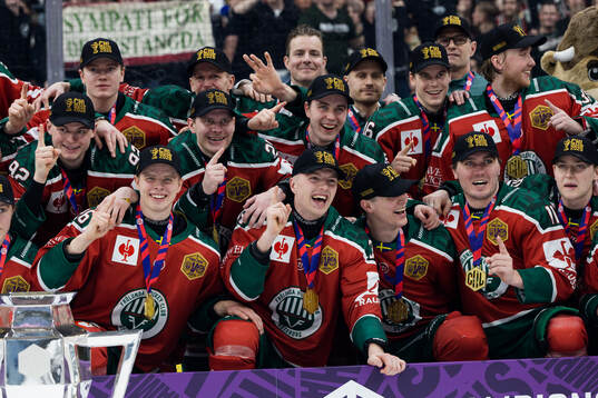 Players of Frölunda celebrate with the trophy