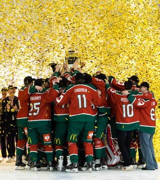 Players of Frölunda celebrate with the trophy