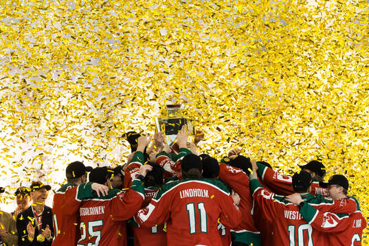Players of Frölunda celebrate with the trophy