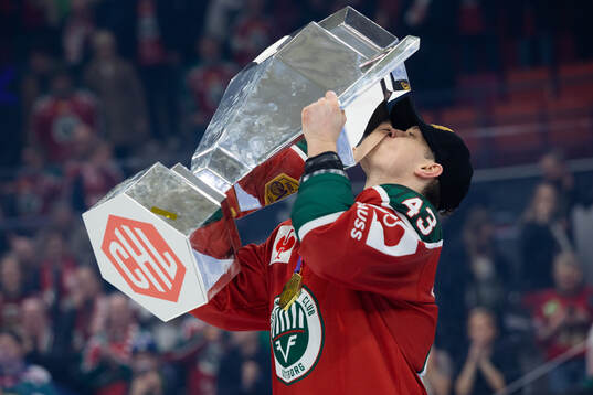 Tom Nilsson of Frölunda celebrates with the trophy