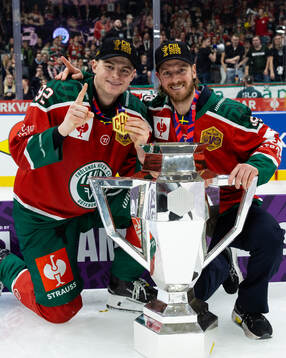 Filip Cederqvist and Erik Thorell celebrate with the trophy