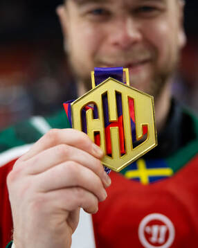 Christian Folin of Frölunda celebrate with the gold medal
