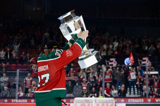 Theodor Niederbach of Frölunda celebrates with the trophy